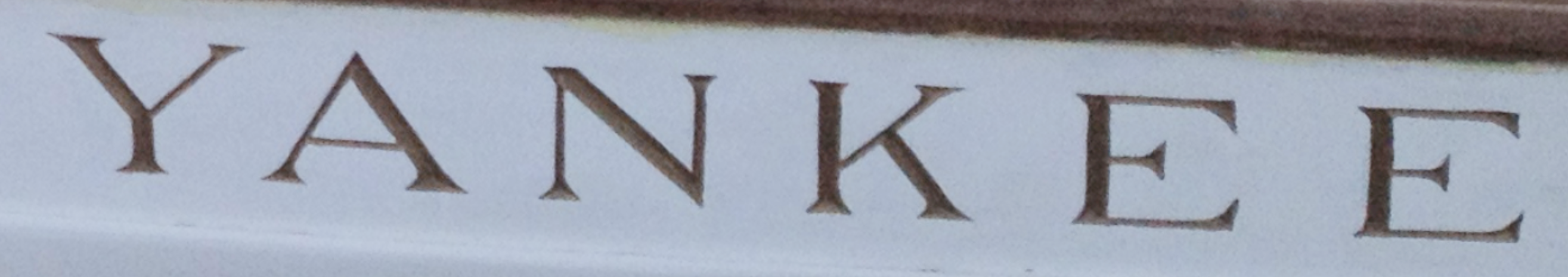 The name YANKEE carved into her transom
